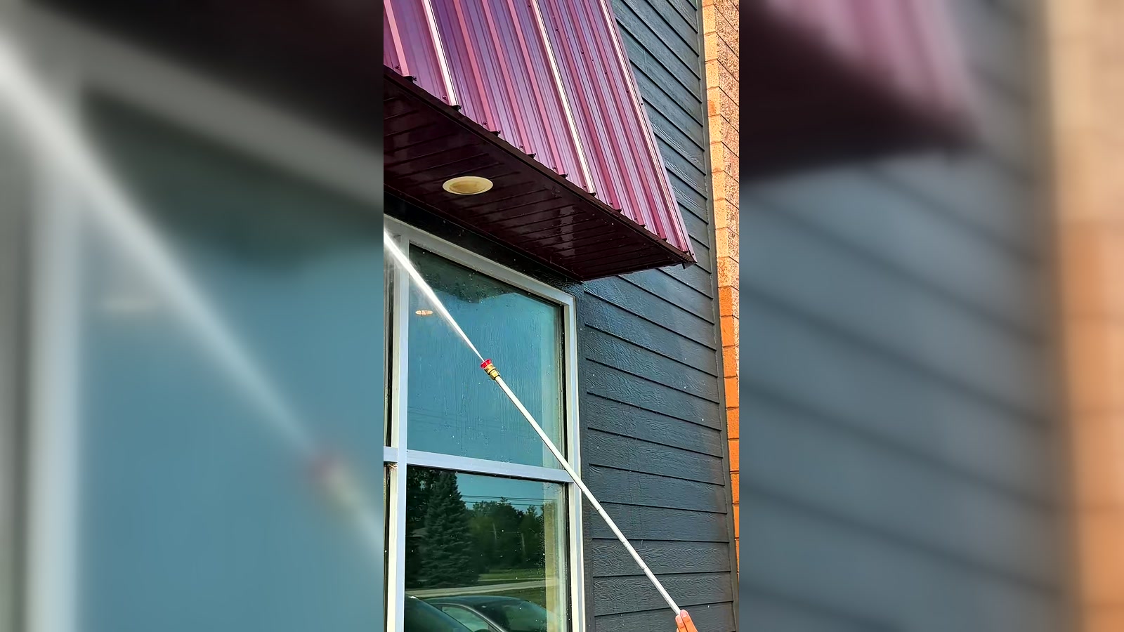 North Standard crew pressure washing a commercial building exterior